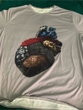 Designer Heart Print Tee with Mixed-Pattern Design. 3 or 4x. Very small pin hole